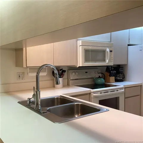 a bedroom with a bed and wall painting