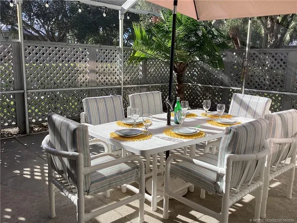 a view of a dining room with furniture window and outside view