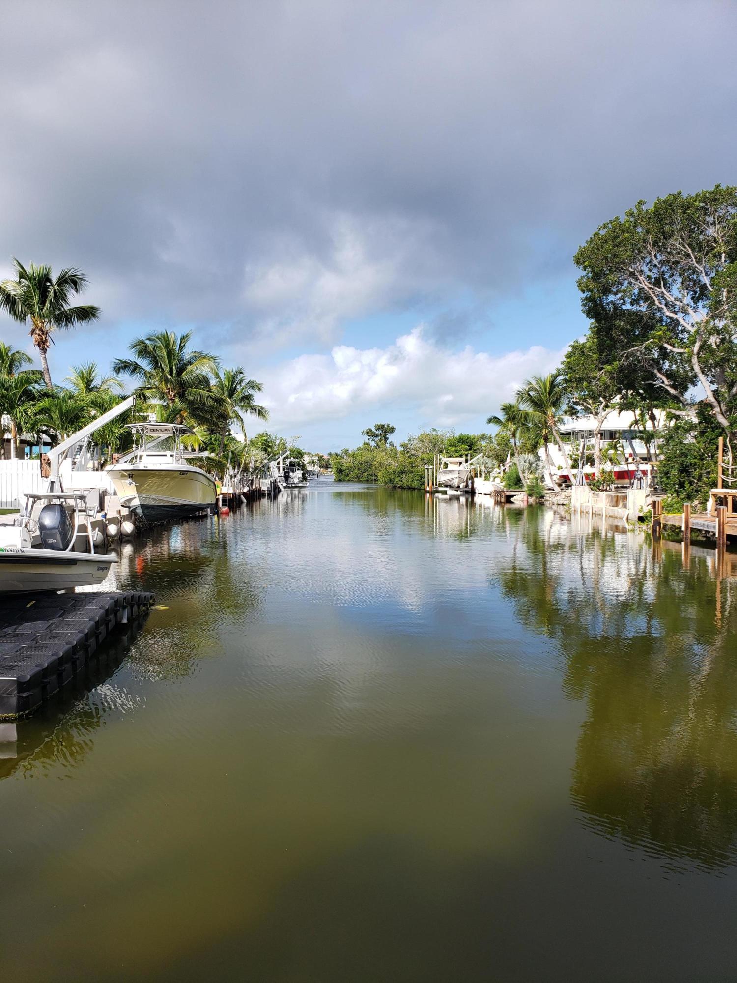 102 Mockingbird Road Tavernier, FL 33070 - Photo 17 of 17 a view of a lake with houses in back
