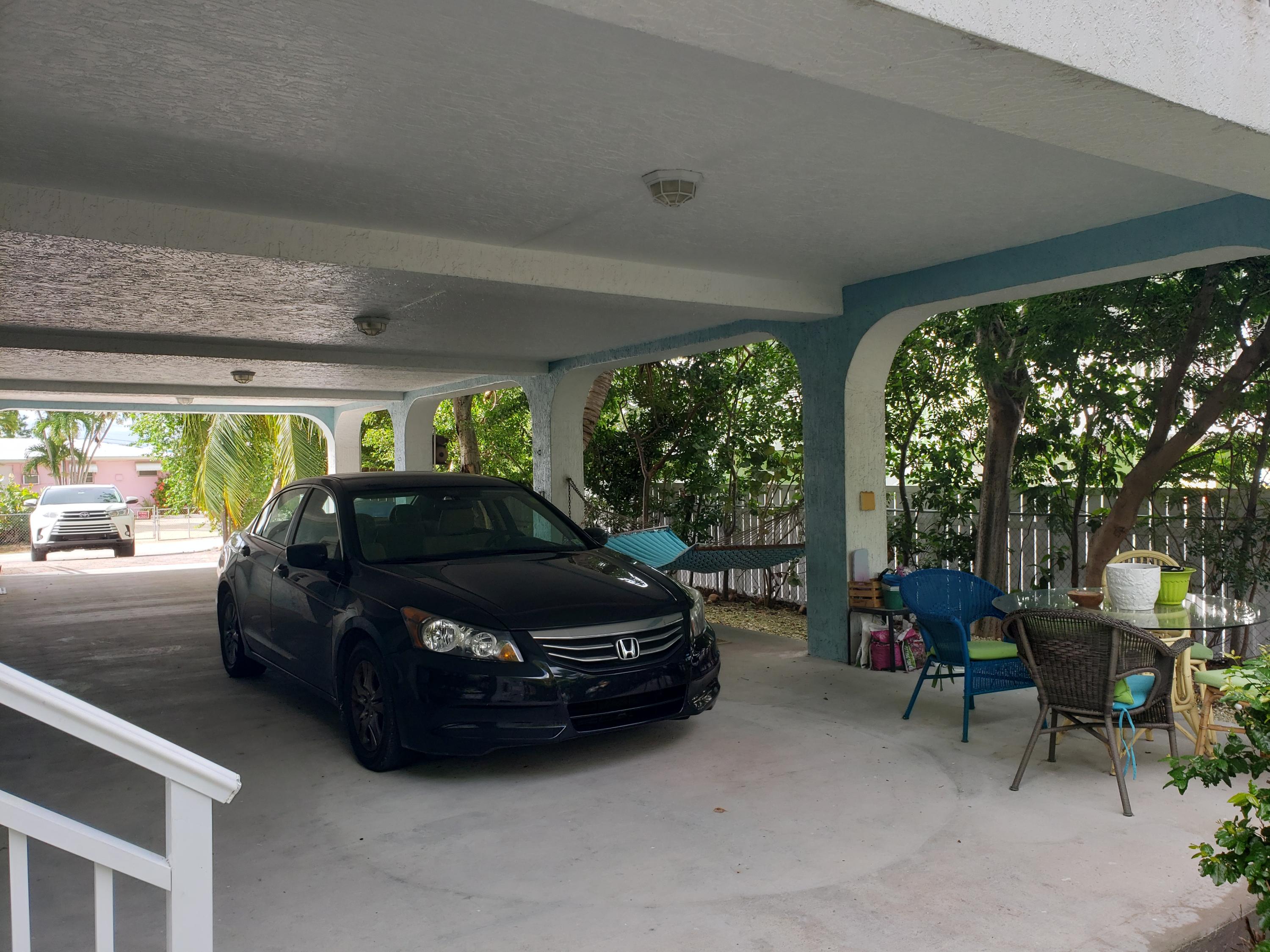 102 Mockingbird Road Tavernier, FL 33070 - Photo 2 of 17 a car parked in a parking garage