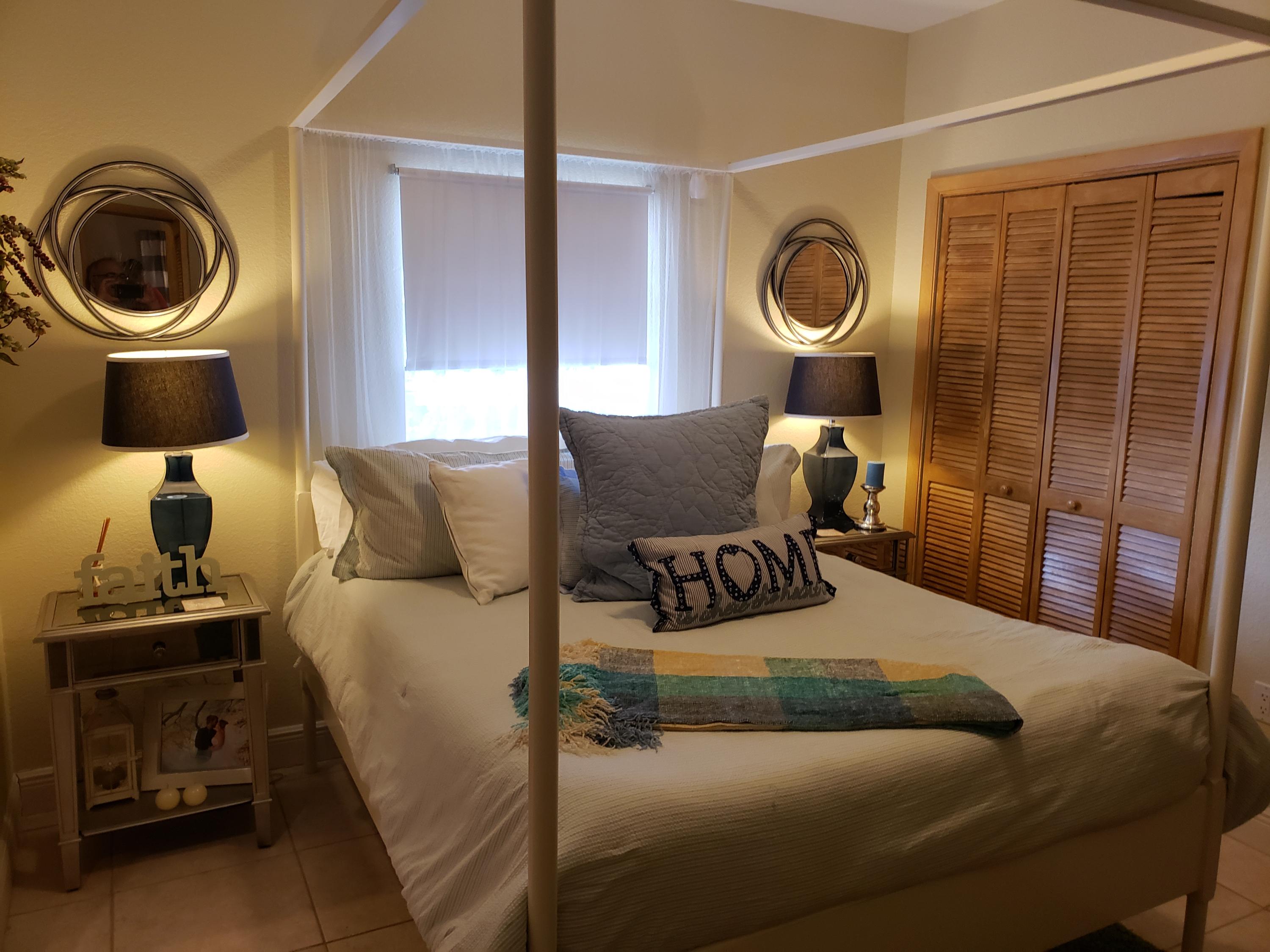 102 Mockingbird Road Tavernier, FL 33070 - Photo 4 of 17 a living room with furniture and a mirror