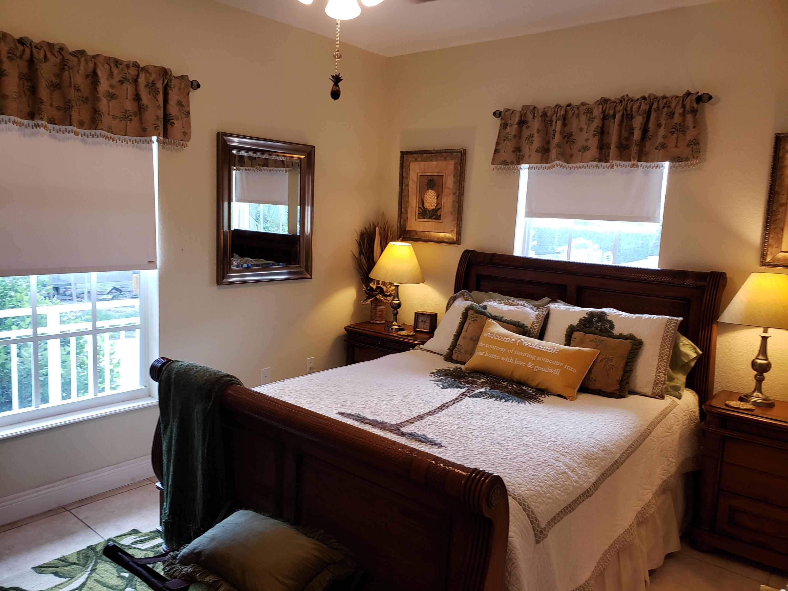 102 Mockingbird Road Tavernier, FL 33070 - Photo 6 of 17 a bedroom with bed and window