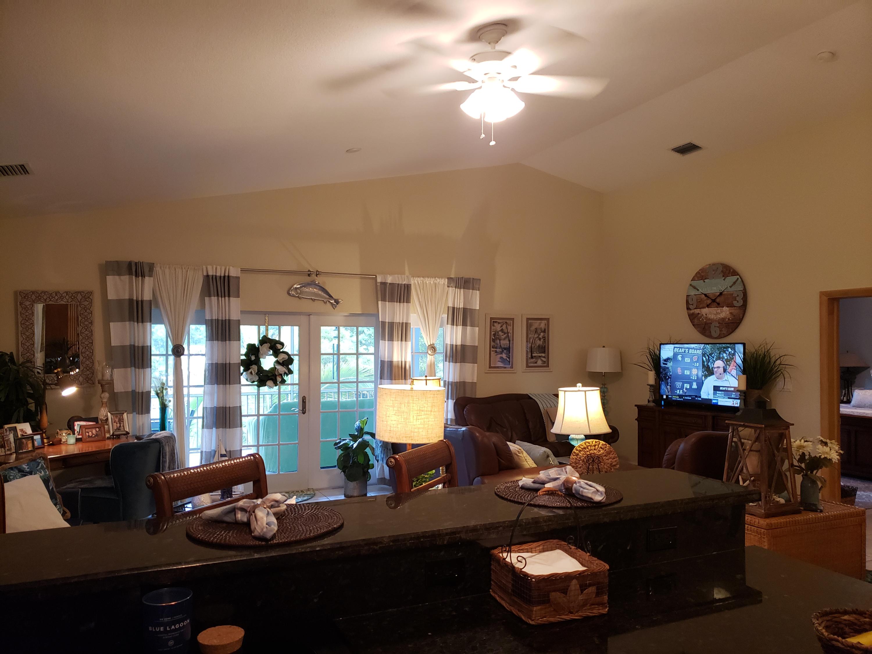 102 Mockingbird Road Tavernier, FL 33070 - Photo 8 of 17 a living room with furniture and a fireplace