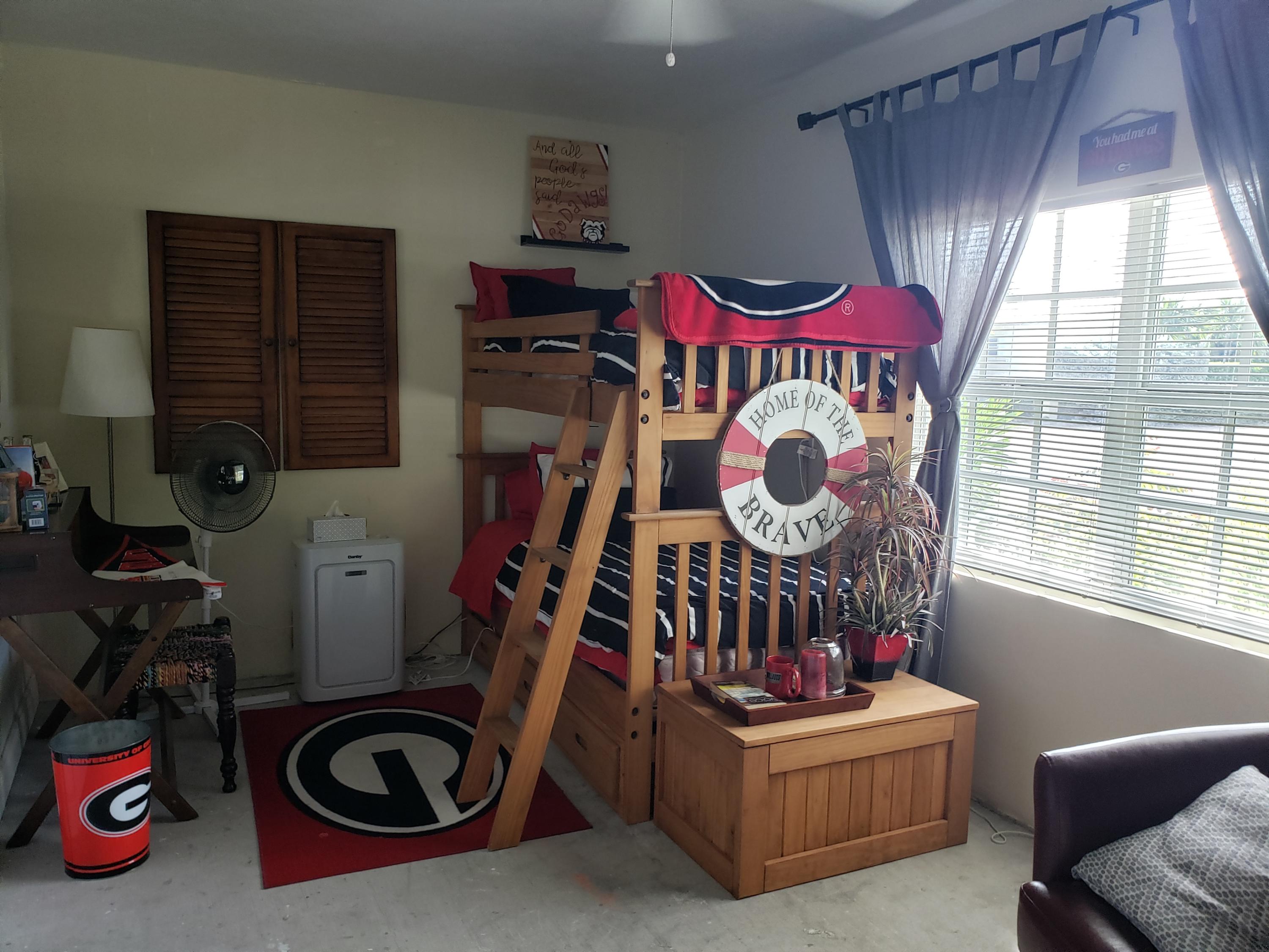 102 Mockingbird Road Tavernier, FL 33070 - Photo 9 of 17 a living room with furniture and a window