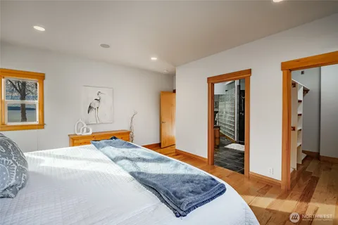 a bedroom with a bed and a dresser in it