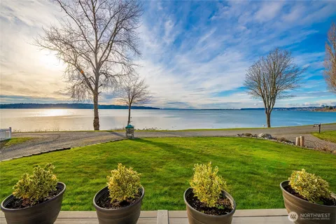 a view of a garden with an ocean view