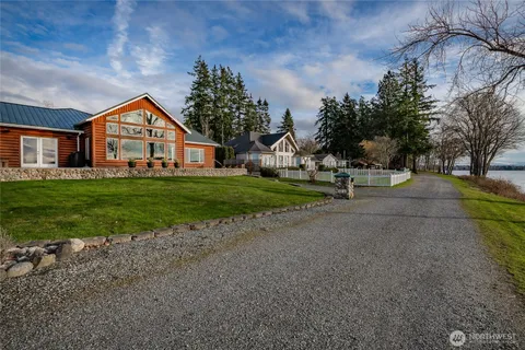 a house with huge green field in front of it