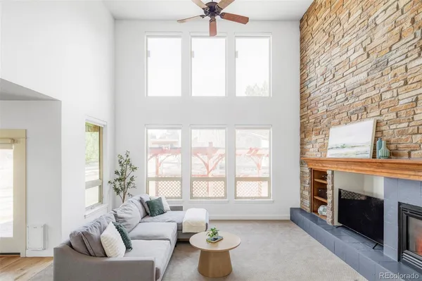 a living room with furniture and a fireplace
