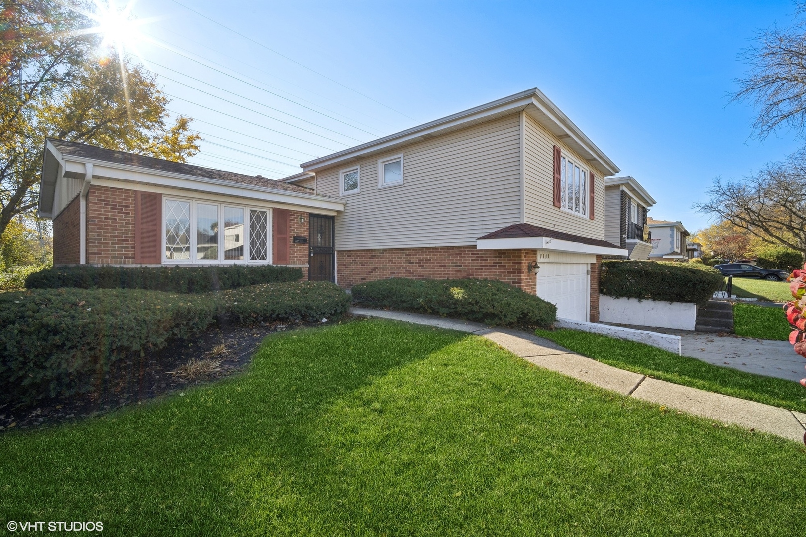 7933 Beckwith Road Morton Grove, IL 60053 - Photo 2 of 32 a front view of house with yard and green space