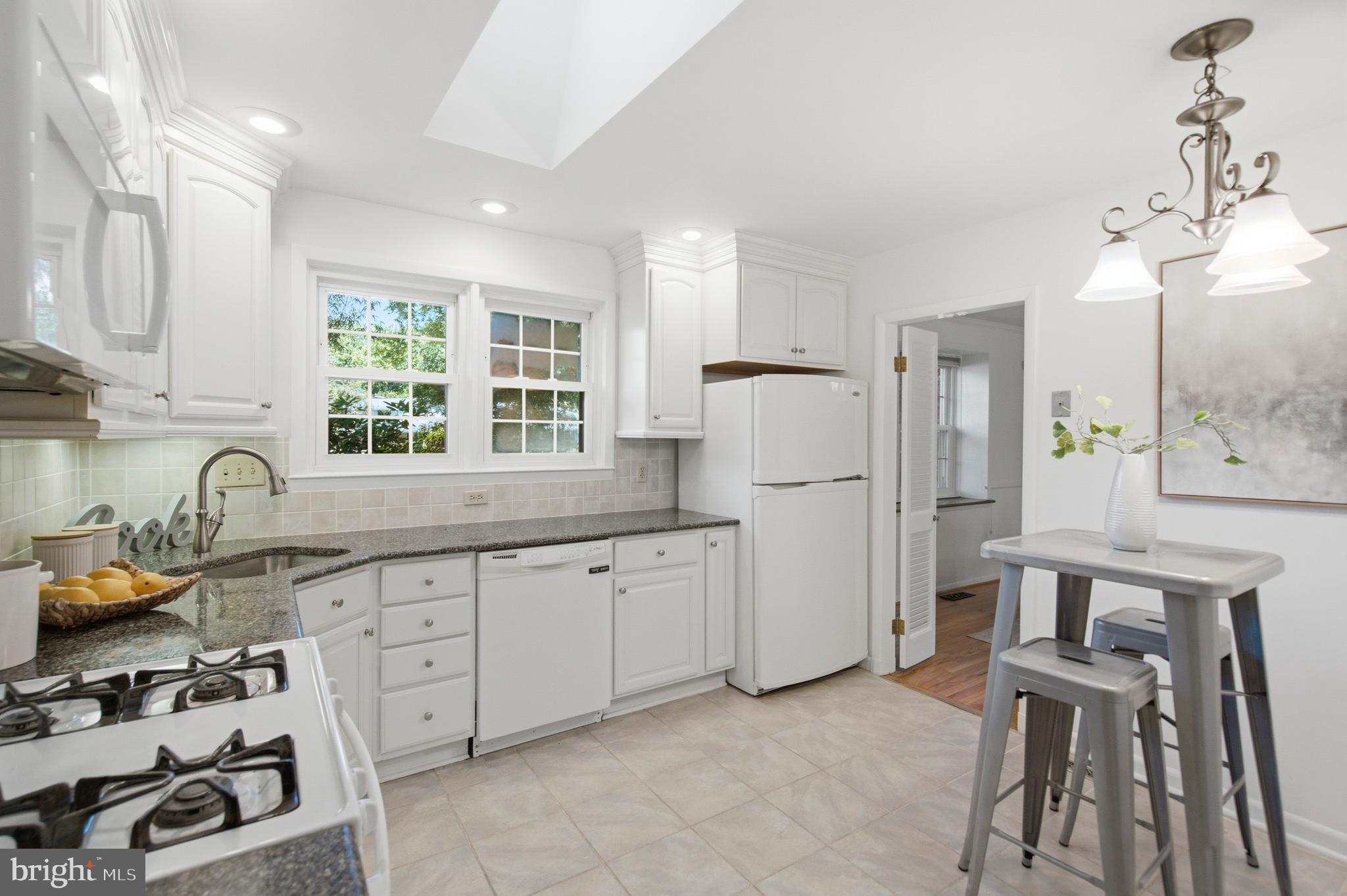 220 Solway Road Lutherville-Timonium, MD 21093 - Photo 10 of 38 a kitchen with white cabinets and refrigerator