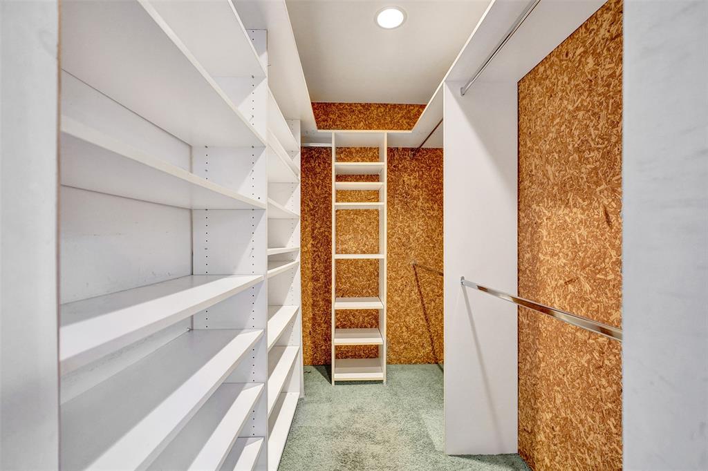 1626 Tyler Street Hollywood, FL 33020 - Photo 15 of 28 a view of walk in closet with clothes