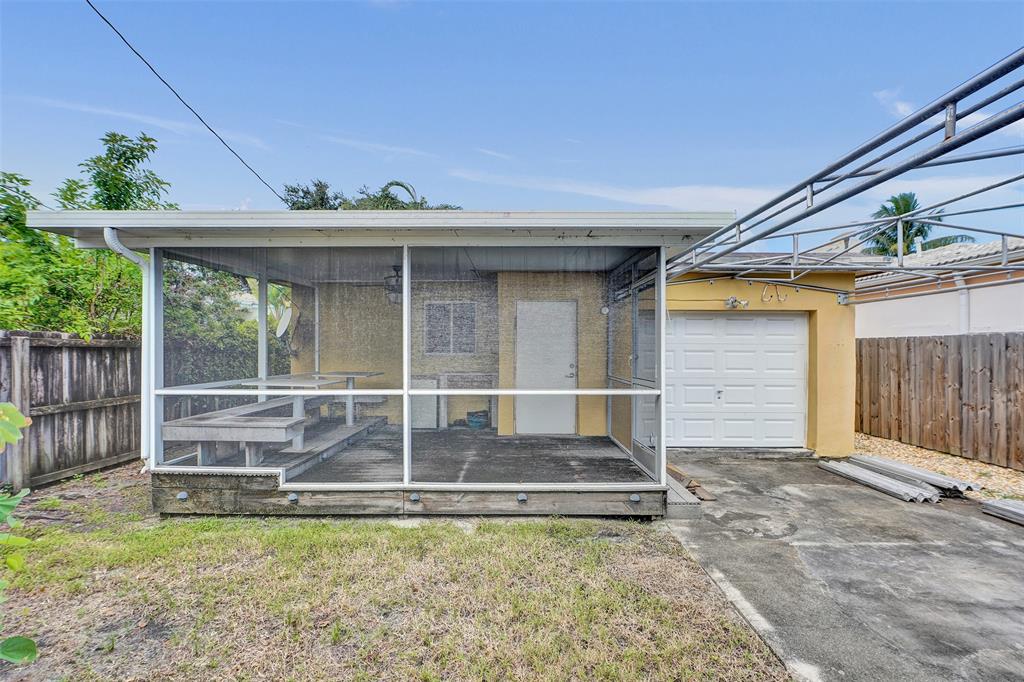 1626 Tyler Street Hollywood, FL 33020 - Photo 24 of 28 a view of a small house and a yard