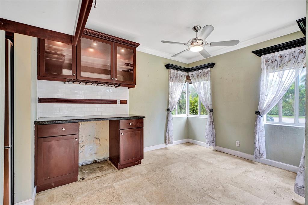 1626 Tyler Street Hollywood, FL 33020 - Photo 6 of 28 a view of an empty room with window and cabinet
