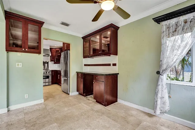 a view of a hallway with entryway and chandelier