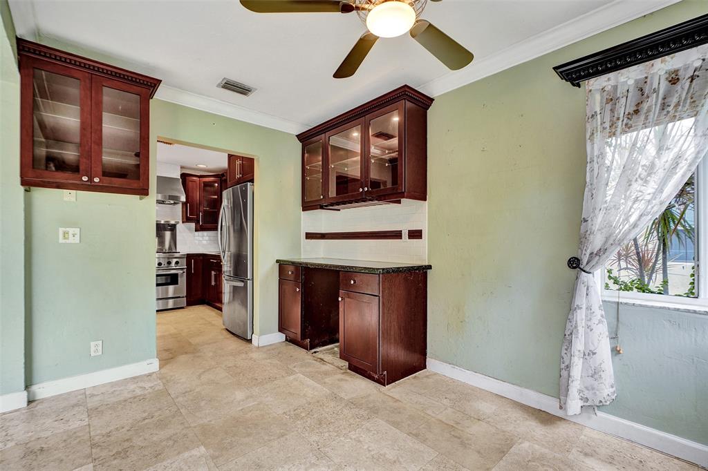 1626 Tyler Street Hollywood, FL 33020 - Photo 7 of 28 a view of a hallway with entryway and chandelier