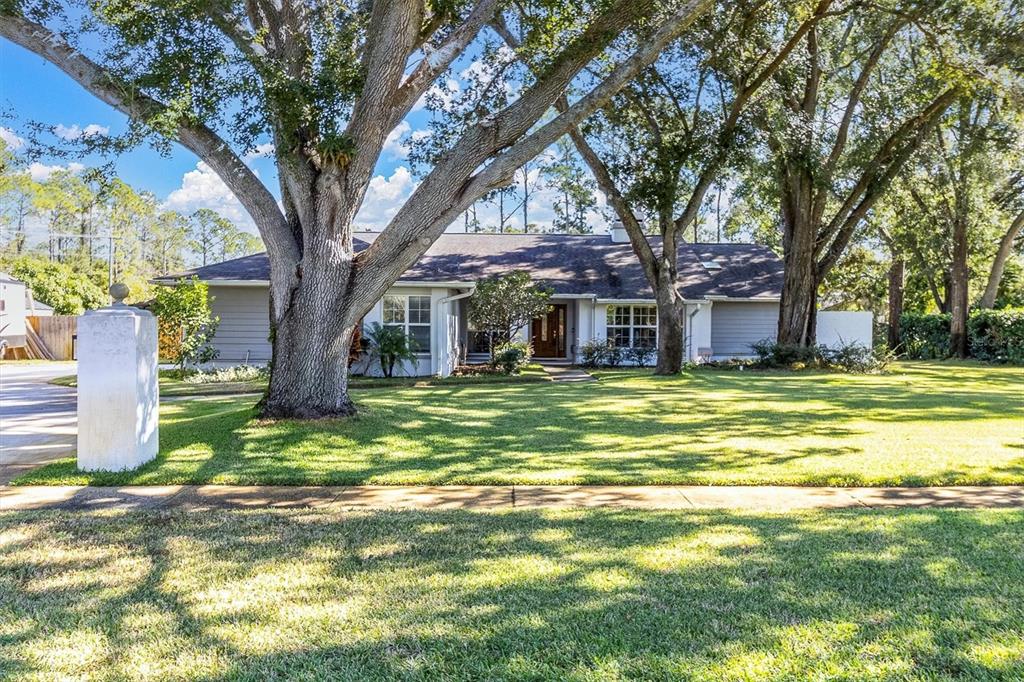 a view of a house with a small yard