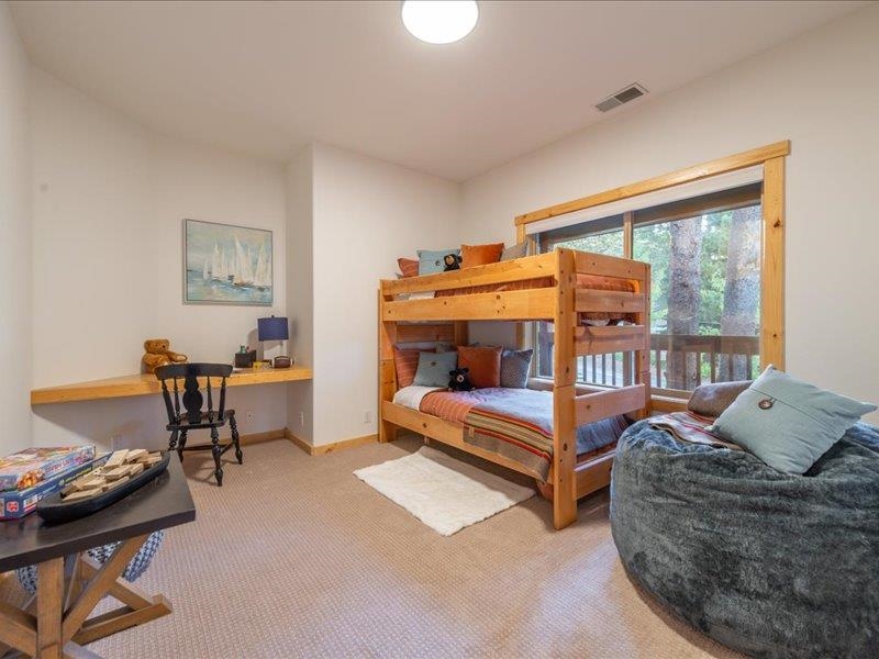 12678 Hidden Circle, Unit 4 Truckee, CA 96161 - Photo 22 of 28 a bedroom with furniture and a window