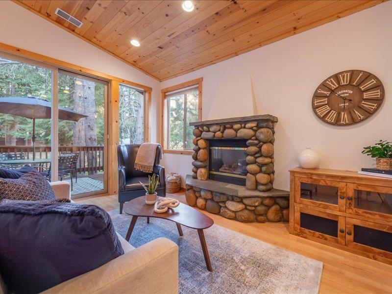 12678 Hidden Circle, Unit 4 Truckee, CA 96161 - Photo 8 of 28 a living room with furniture a flat screen tv and a fireplace