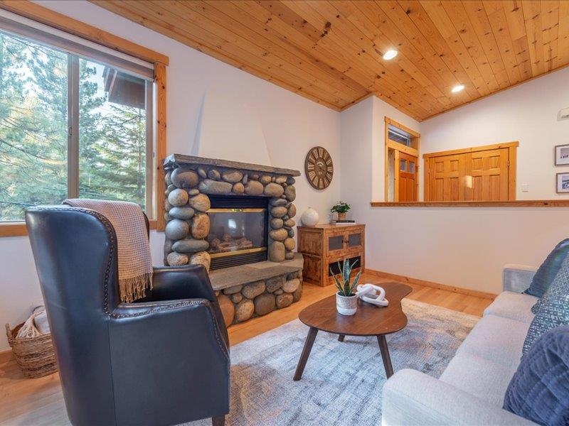 12678 Hidden Circle, Unit 4 Truckee, CA 96161 - Photo 9 of 28 a living room with furniture a rug and a clock