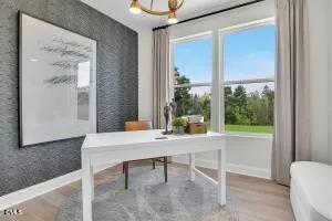 a workspace with furniture and a window