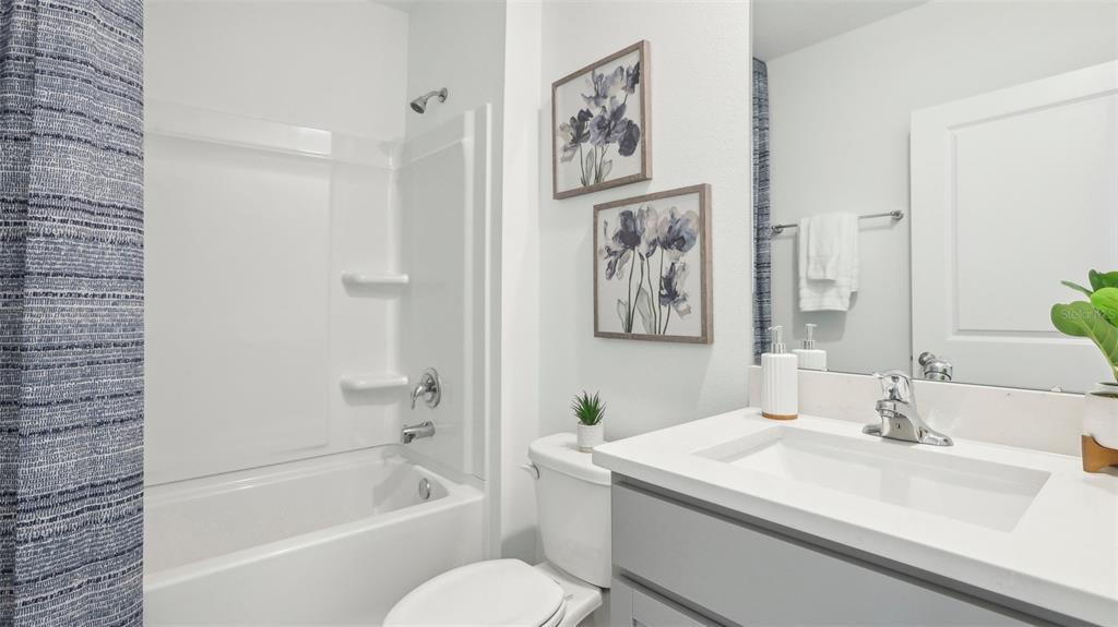 35446 Brick Church Loop Dade City, FL 33525 - Photo 16 of 25 a bathroom with a sink toilet and shower