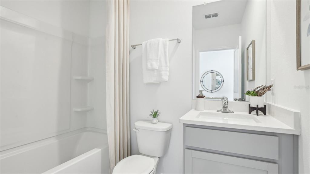 35446 Brick Church Loop Dade City, FL 33525 - Photo 5 of 25 a bathroom with a sink toilet and shower