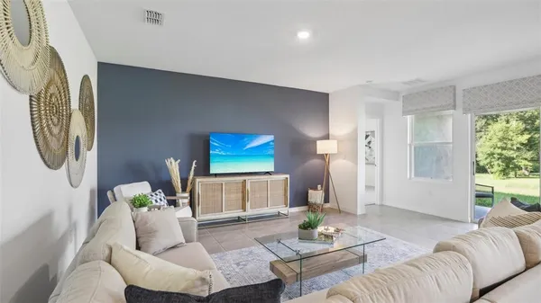 a living room with furniture and a window