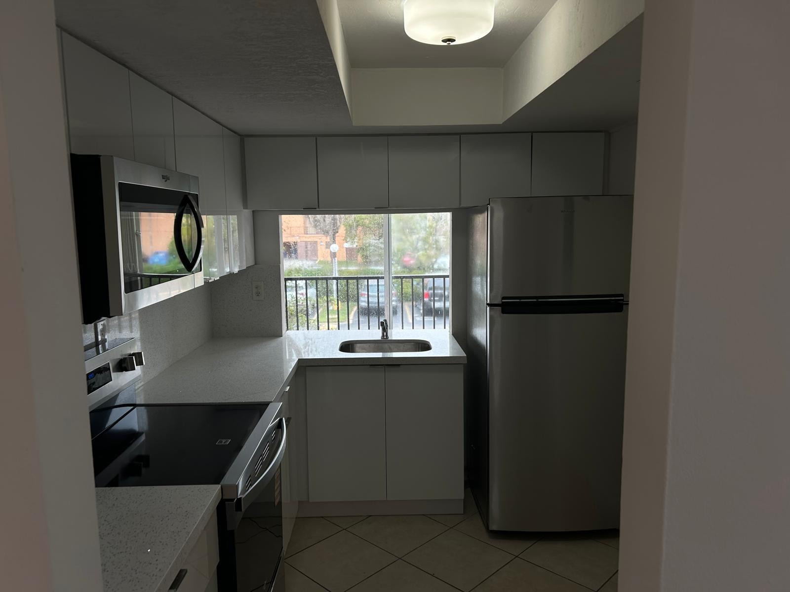 a kitchen with a sink appliances and cabinets