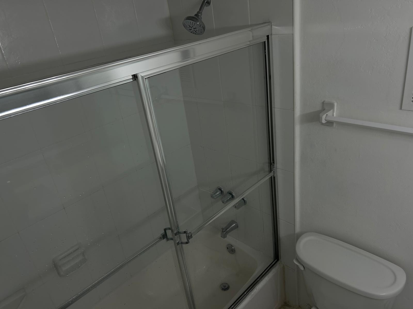 9441 Southwest 4th Street, Unit 202 Miami, FL 33174 - Photo 14 of 21 a bathroom with a granite countertop toilet and sink