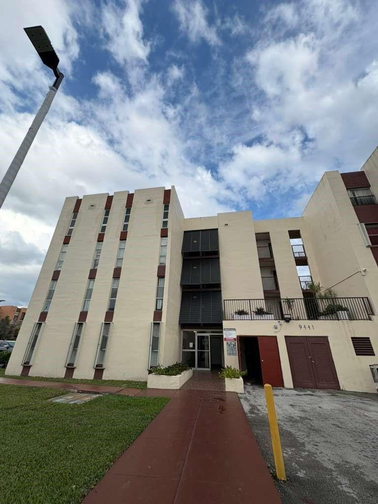 9441 Southwest 4th Street, Unit 202 Miami, FL 33174 - Photo 21 of 21 a view of building with yard