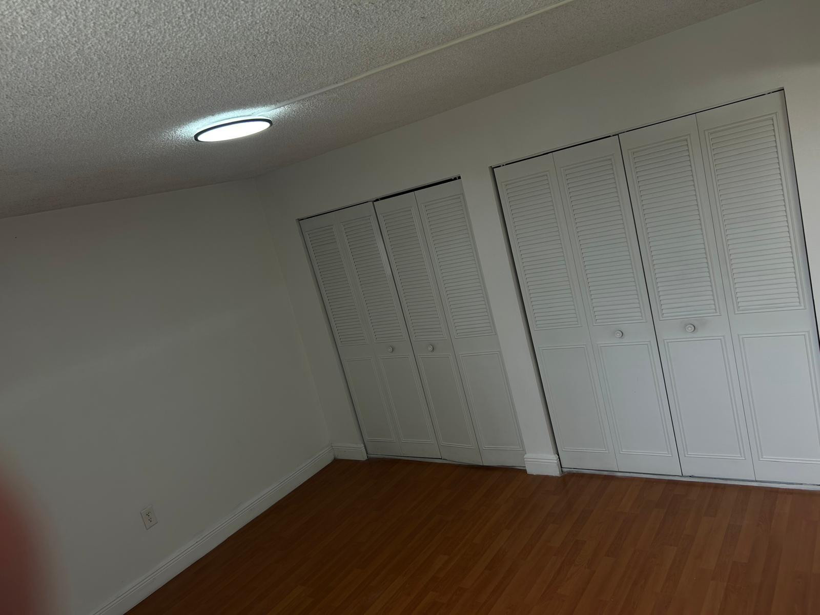 9441 Southwest 4th Street, Unit 202 Miami, FL 33174 - Photo 5 of 21 a view of an empty room