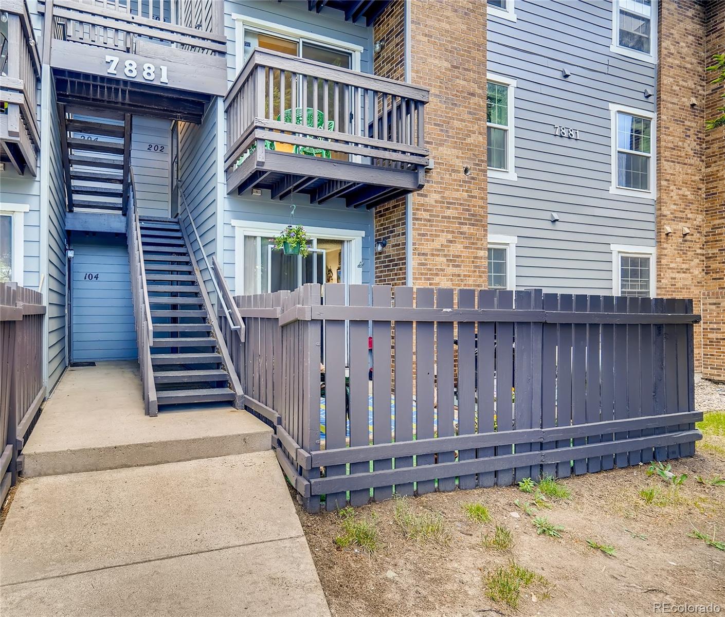 7881 Allison Way, Unit 202 Arvada, CO 80005 - Photo 1 of 26 a view of a house with wooden deck