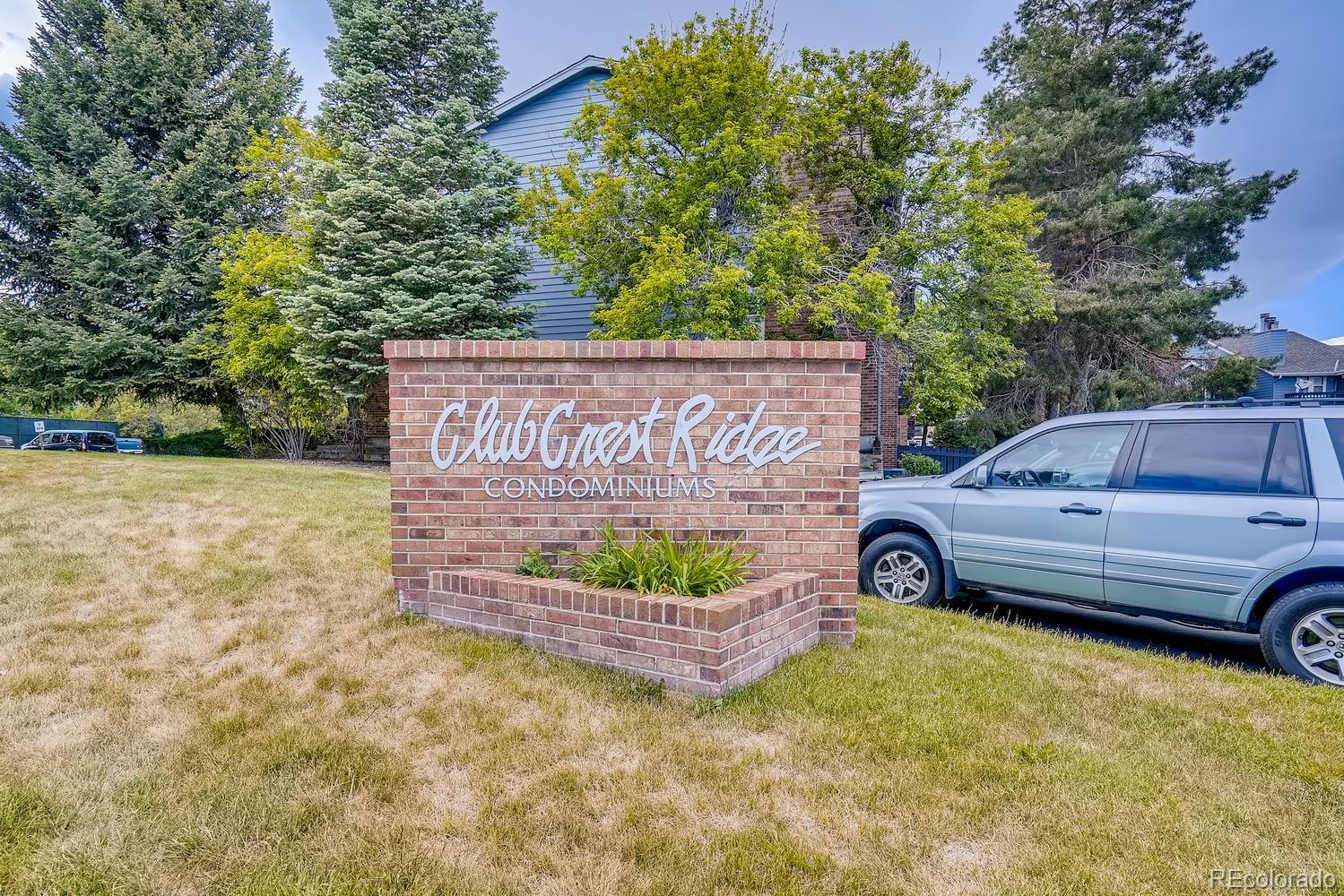 7881 Allison Way, Unit 202 Arvada, CO 80005 - Photo 2 of 26 a front view of a house with garden