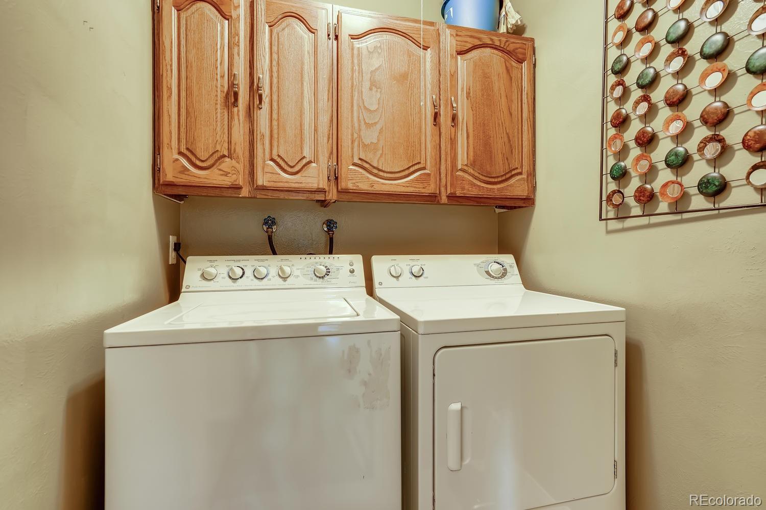 7881 Allison Way, Unit 202 Arvada, CO 80005 - Photo 23 of 26 a utility room with dryer and washer