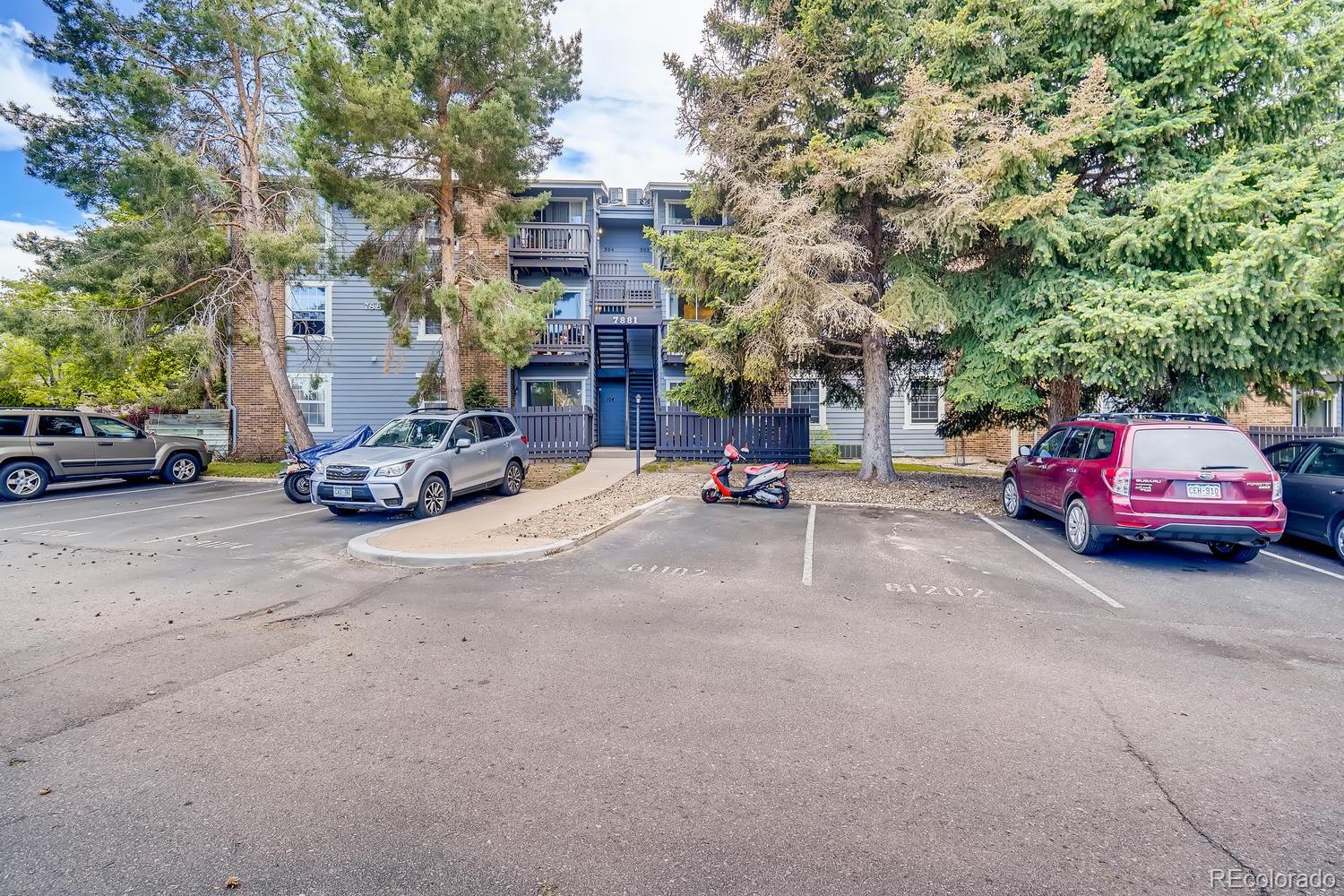 7881 Allison Way, Unit 202 Arvada, CO 80005 - Photo 3 of 26 a car parked on the side of a street