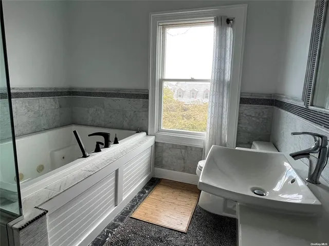 a room with a couch and a window