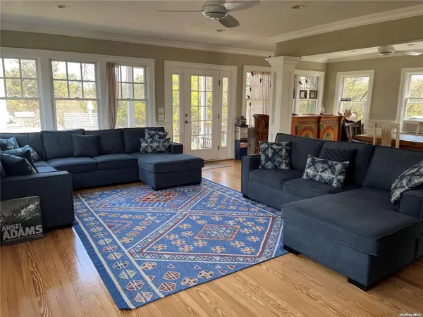 a living room with furniture or couch and a large window
