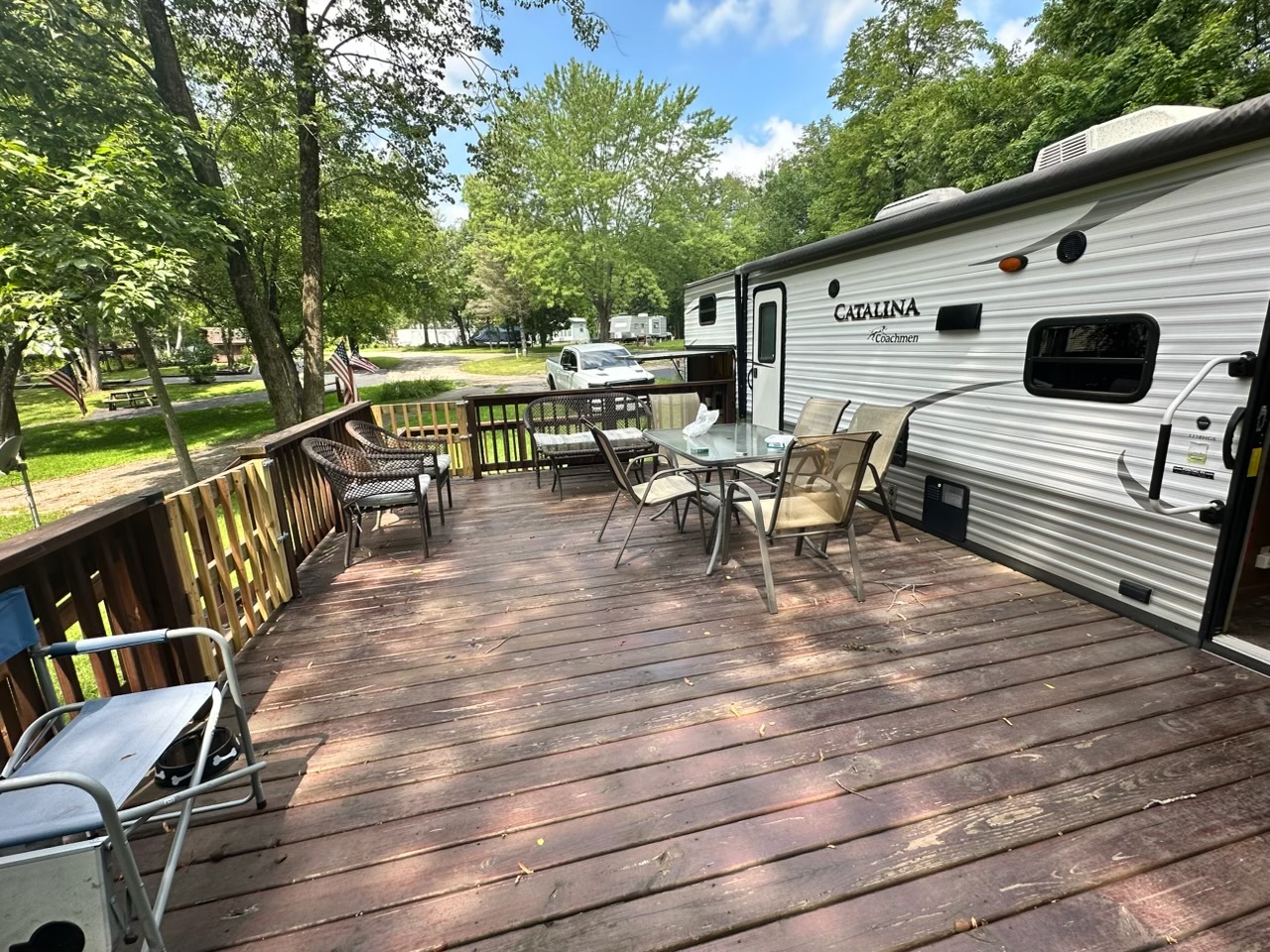 2795 East 28th Road Marseilles, IL 61341 - Photo 2 of 11 a balcony with wooden benches and trees