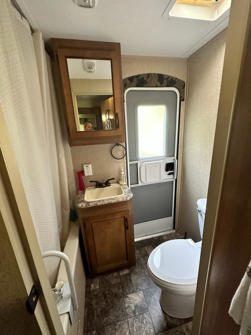 2795 East 28th Road Marseilles, IL 61341 - Photo 3 of 11 a bathroom with a granite countertop toilet sink and mirror