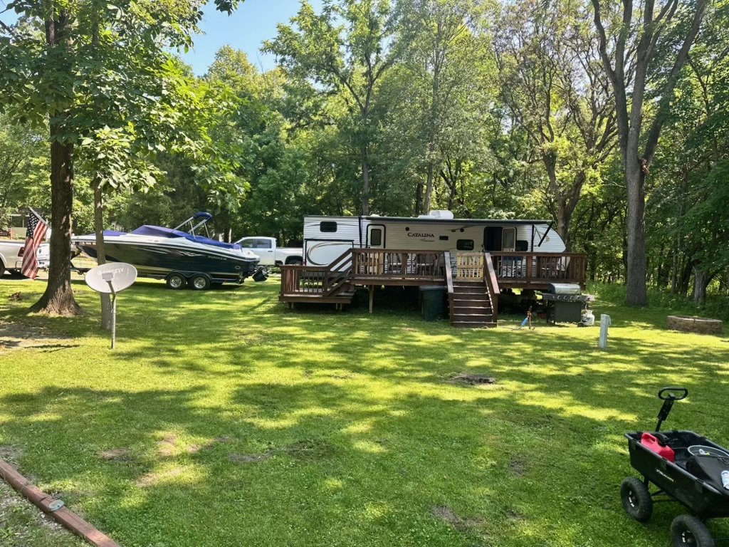 2795 East 28th Road Marseilles, IL 61341 - Photo 7 of 11 a backyard of a house with table and chairs