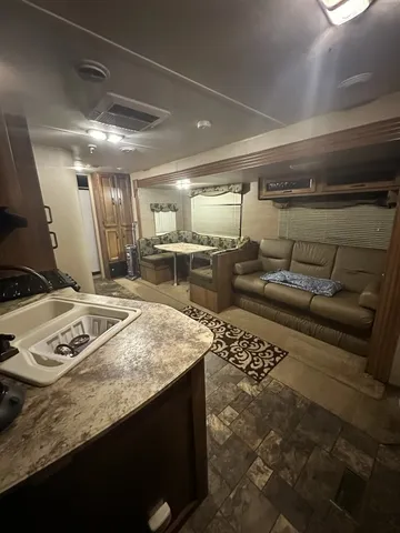 a kitchen with refrigerator and stove