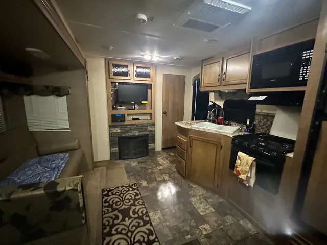 a kitchen with refrigerator and stove