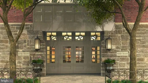 a front view of a building with glass windows and door