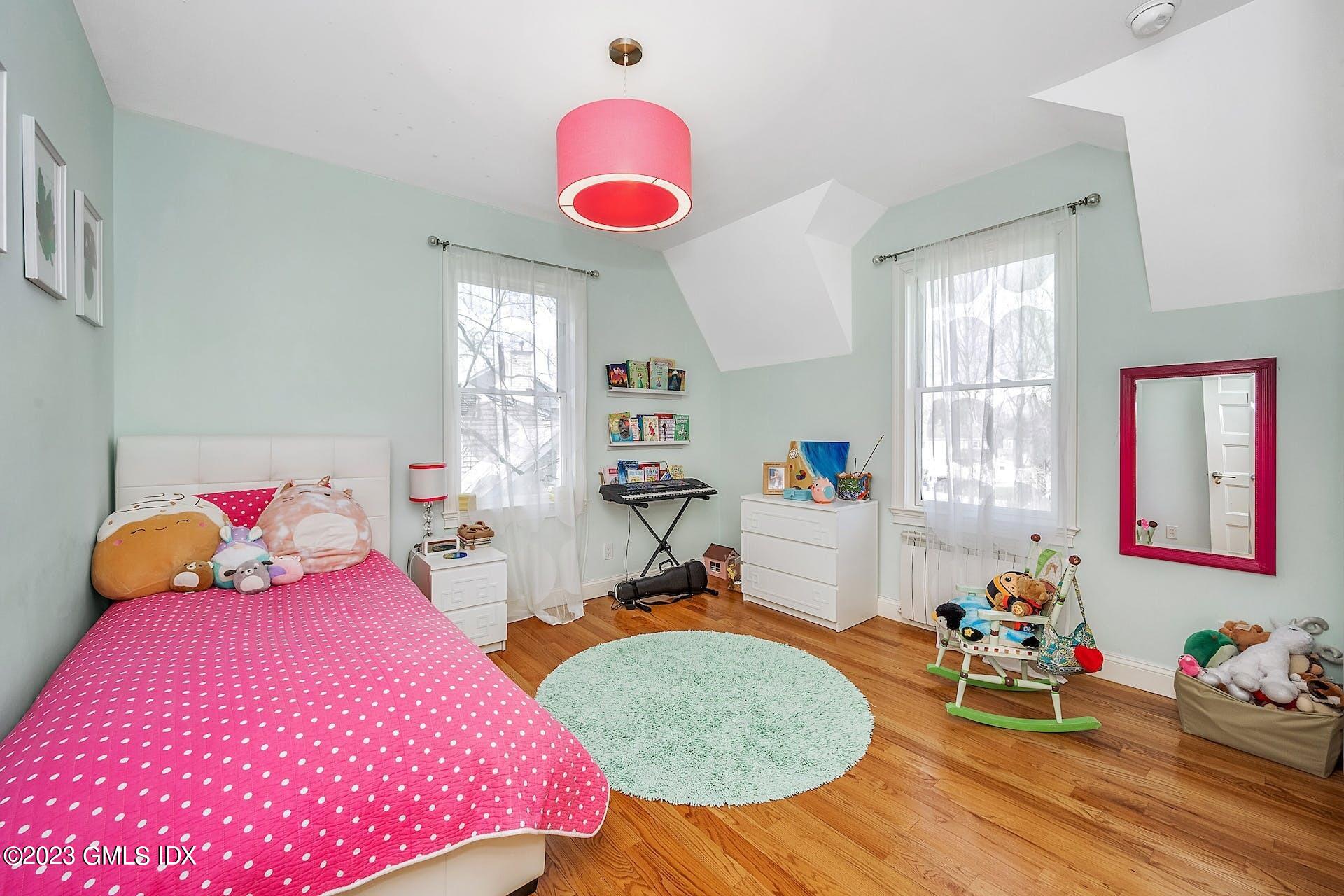 58 Upland Road Stamford, CT 06906 - Photo 20 of 32 a bedroom with bed and window