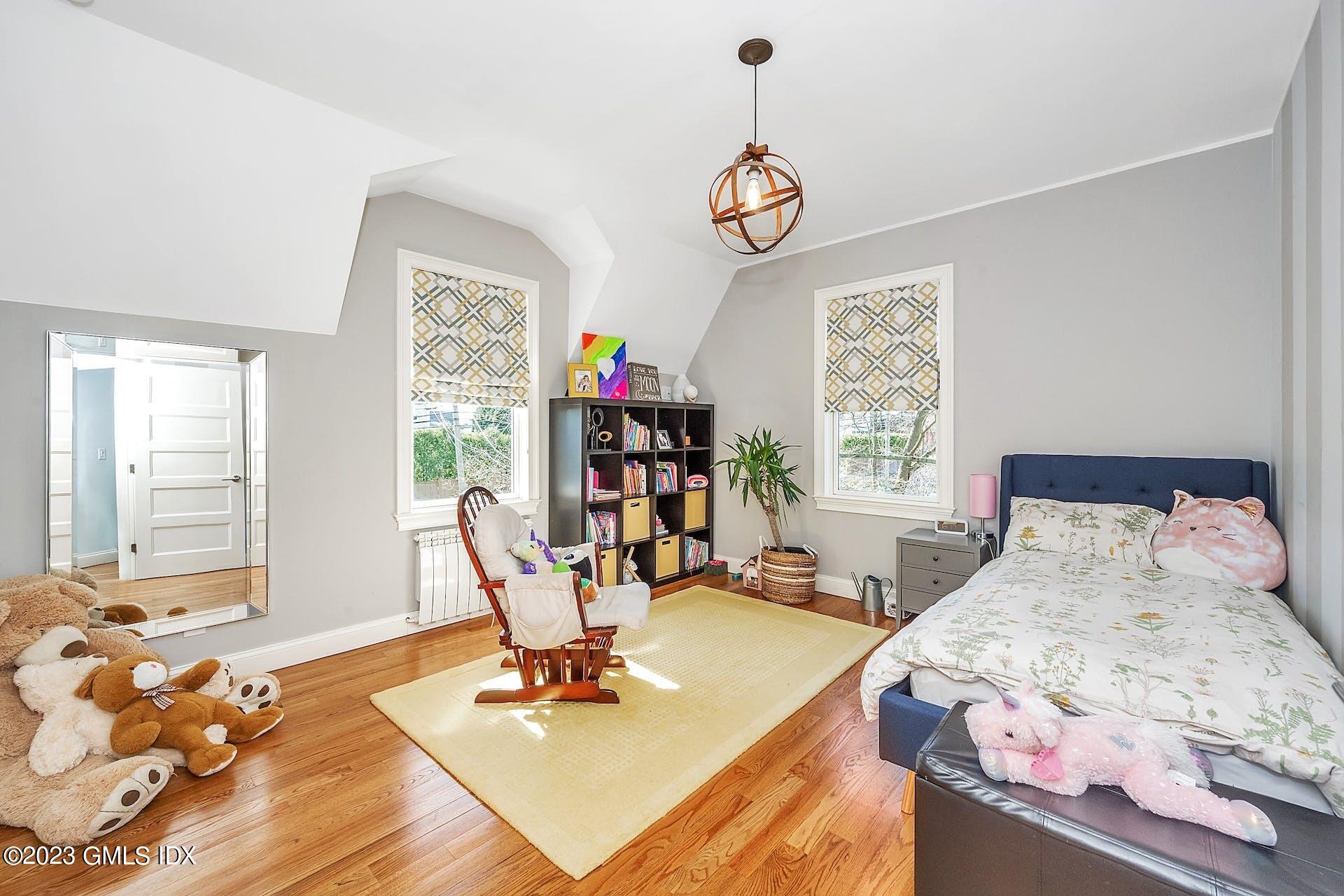 58 Upland Road Stamford, CT 06906 - Photo 21 of 32 a living room with furniture and a large window