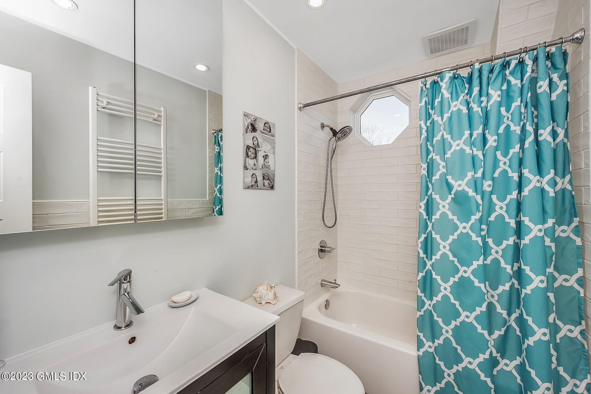 58 Upland Road Stamford, CT 06906 - Photo 24 of 32 a bathroom with a sink toilet and shower