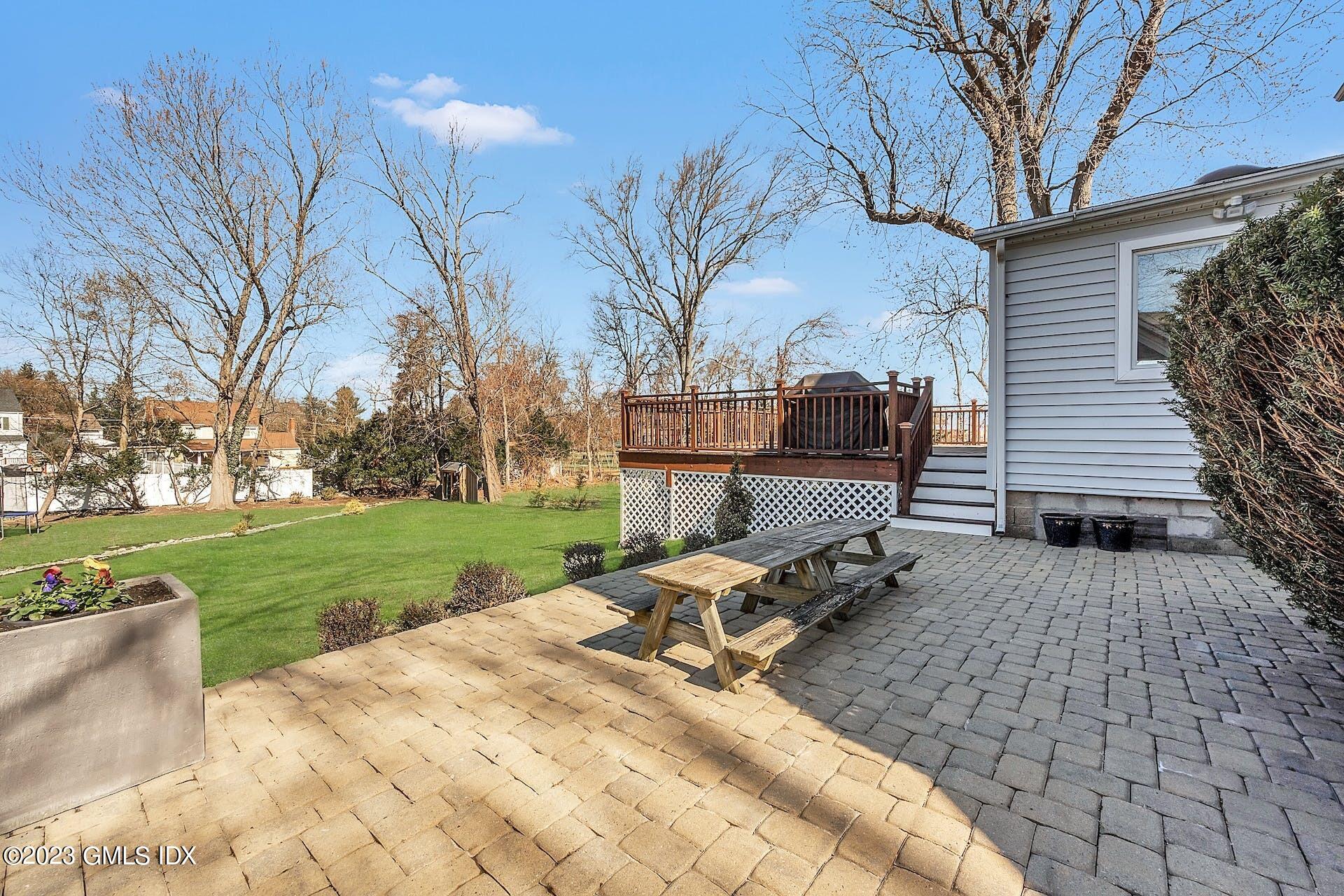 58 Upland Road Stamford, CT 06906 - Photo 29 of 32 a view of a backyard with sitting area