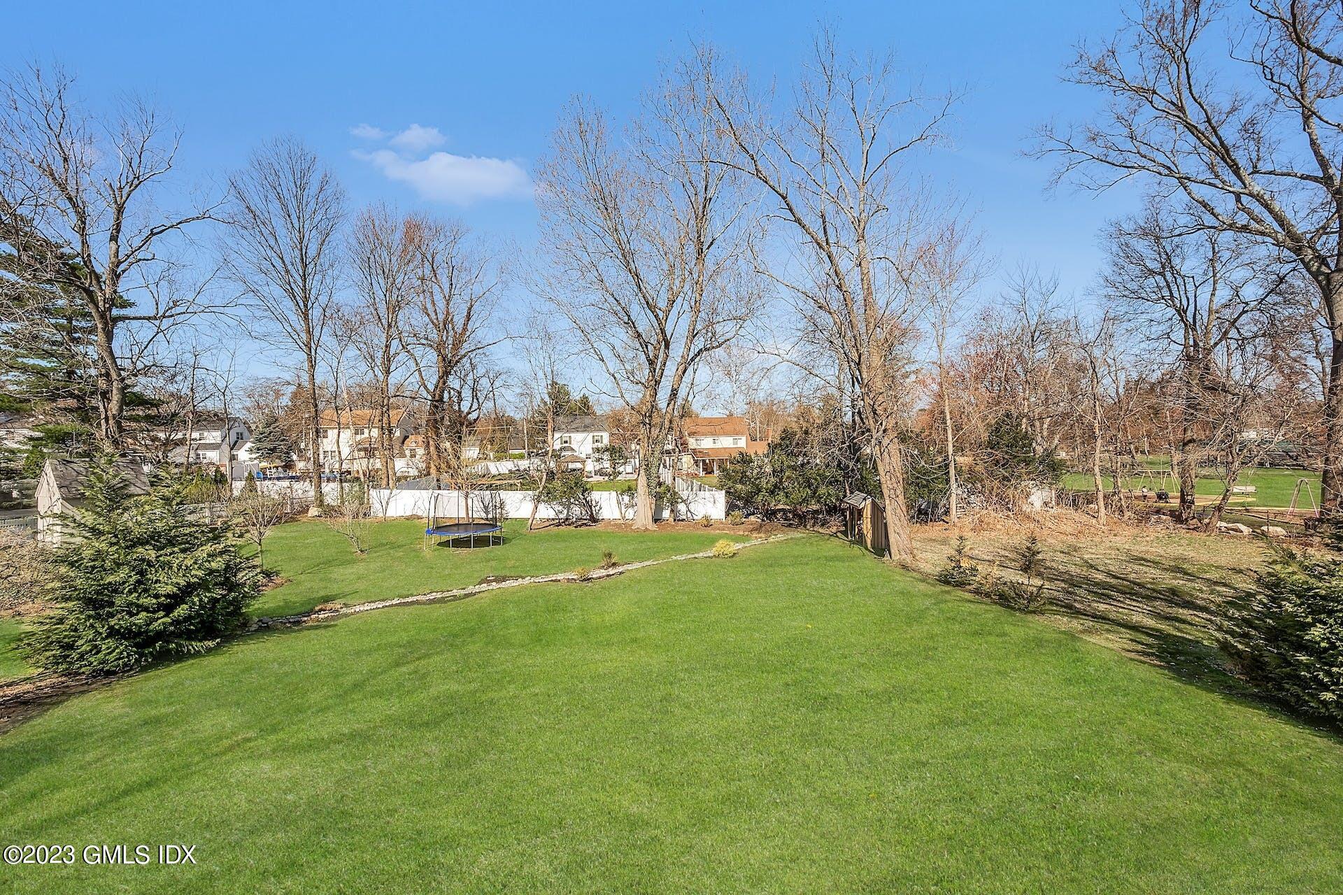 58 Upland Road Stamford, CT 06906 - Photo 30 of 32 a view of road with large trees