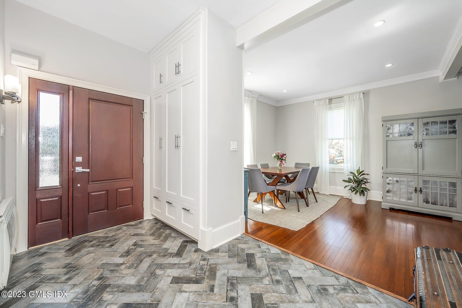 58 Upland Road Stamford, CT 06906 - Photo 3 of 32 a living room with furniture and a wooden floor