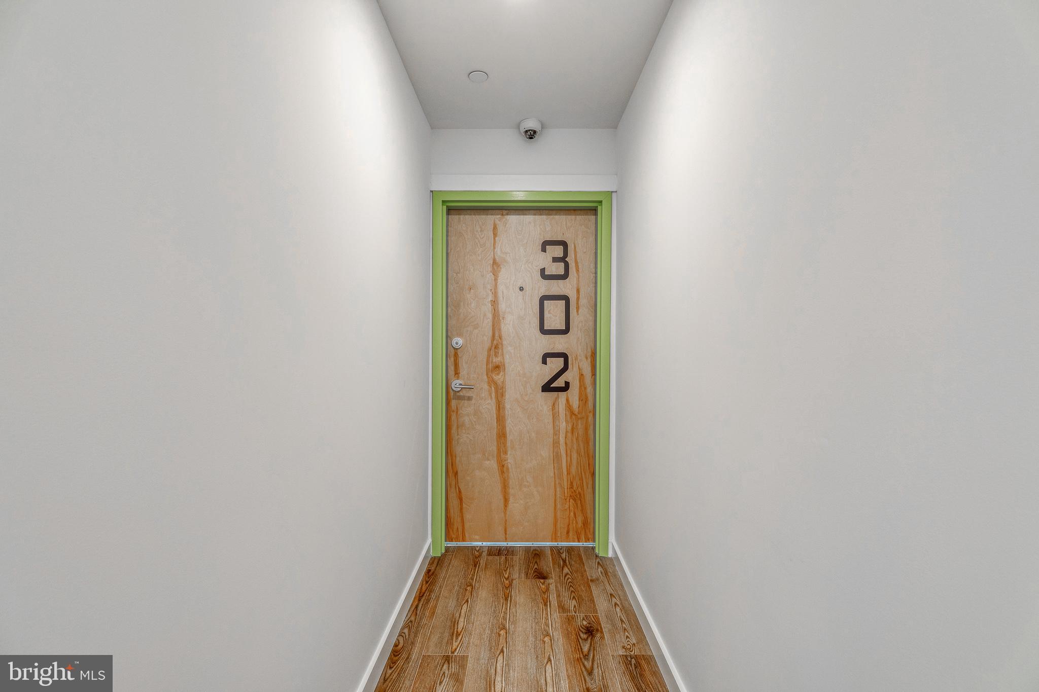 751 North 43rd Street, Unit 302 Philadelphia, PA 19104 - Photo 17 of 17 a view of a hallway with wooden floor